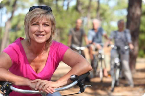 Image: /uploads/blog/Lady-leaning-on-bike.jpg
